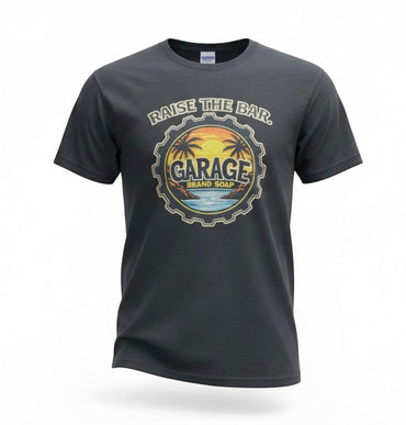 Garage Brand Soap unisex charcoal grey t-shirt featuring a circular Raise the Bar sunset and palm tree graphic.