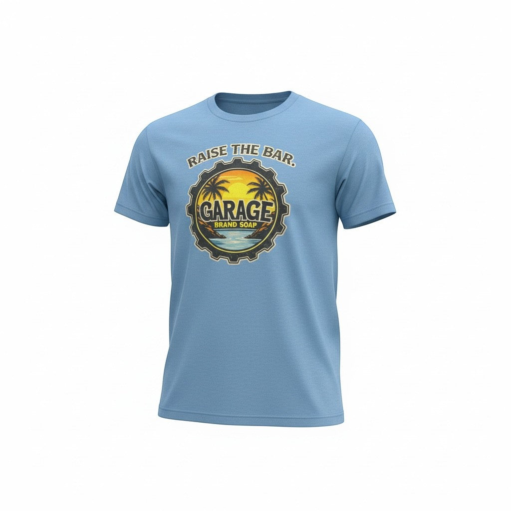 Garage Brand Soap light blue unisex graphic t-shirt with a sunset, palm tree, and gear logo design.