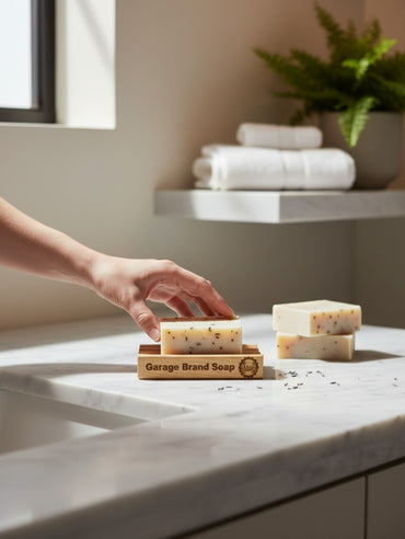 Garage Brand Soap laser engraved wooden soap dish holding a bar of soap on a marble bathroom counter